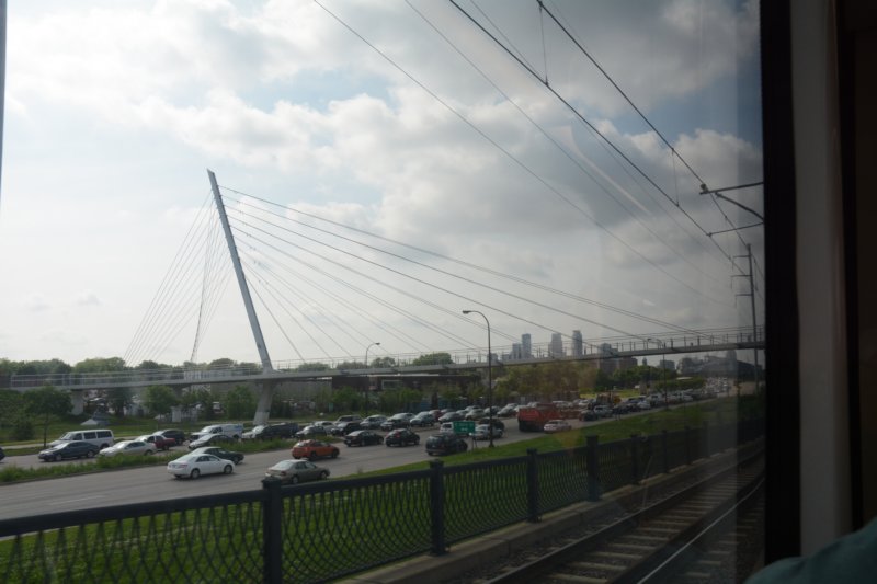 nextivisitwithbilllynneoverlandinminneapolisandhetakesmeonalightrailtourofthecitiesherewerepassingthemidtowngreenwaypedestrianbridge.jpg